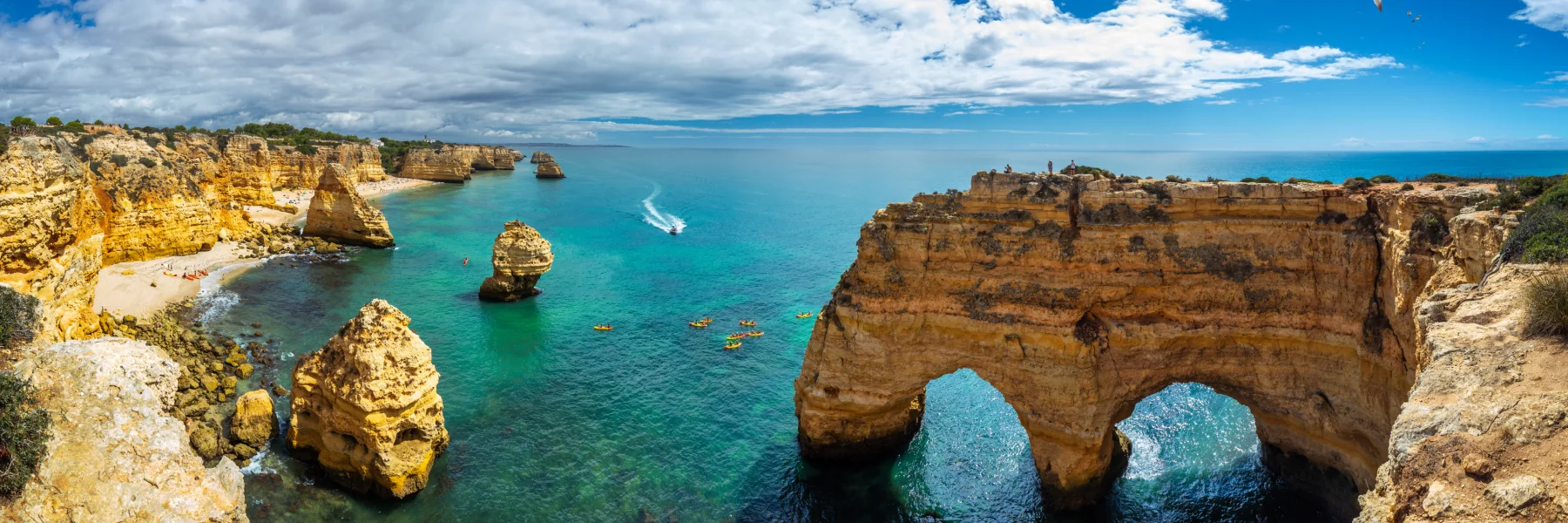 Explore Algarve, Portugal, a sun-soaked paradise with golden beaches, cliffs, and charming coastal towns